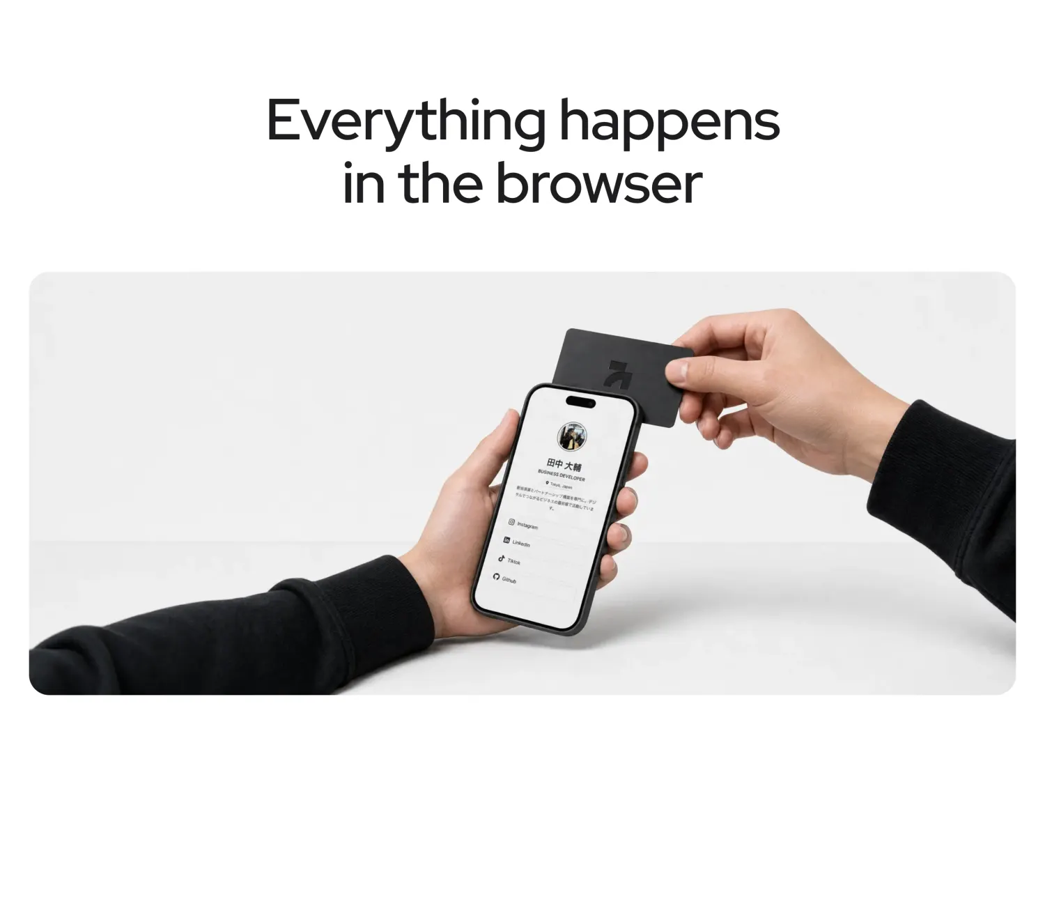 A photograph of one hand tapping the card to a phone held in the other, profile already open